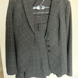 Classifies Entier suit.  Size 12 black with tiny beige line.